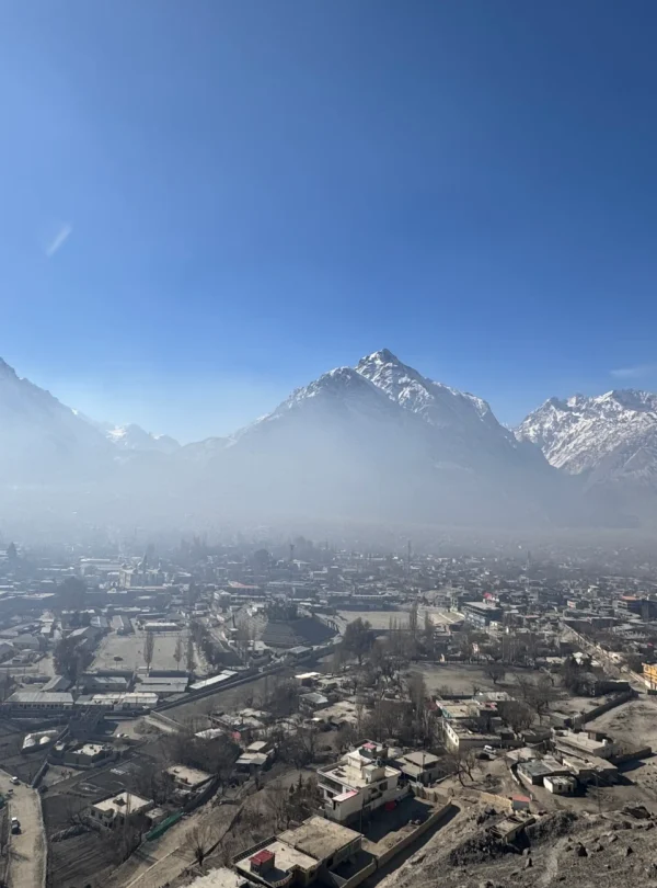 Skardu town aerial panorama with snow-capped Karakoram peaks and morning mist over Gilgit-Baltistan valleys