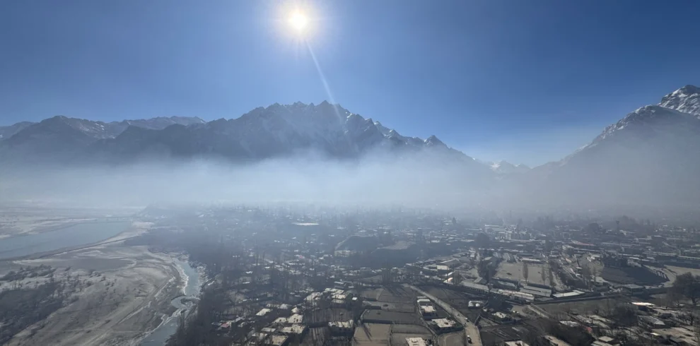Skardu valley morning mist with Karakoram mountain peaks and terraced settlements before Braldu Valley trek